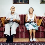 Mature couple sitting on a couch